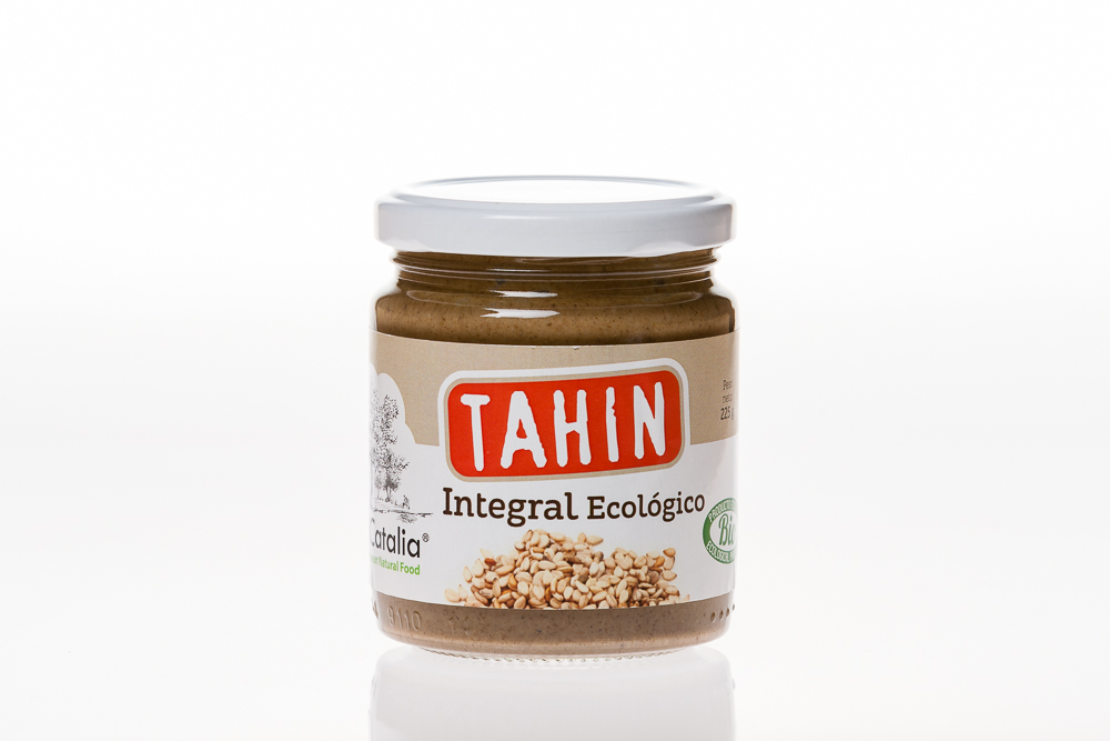 Se muestra un tarro de cristal de Crema de Tahin Integral Ecológico 225g de Jijona S.A., con tapa blanca y etiqueta BIO, etiquetado "Tahin Integral Ecológico", sobre fondo blanco.