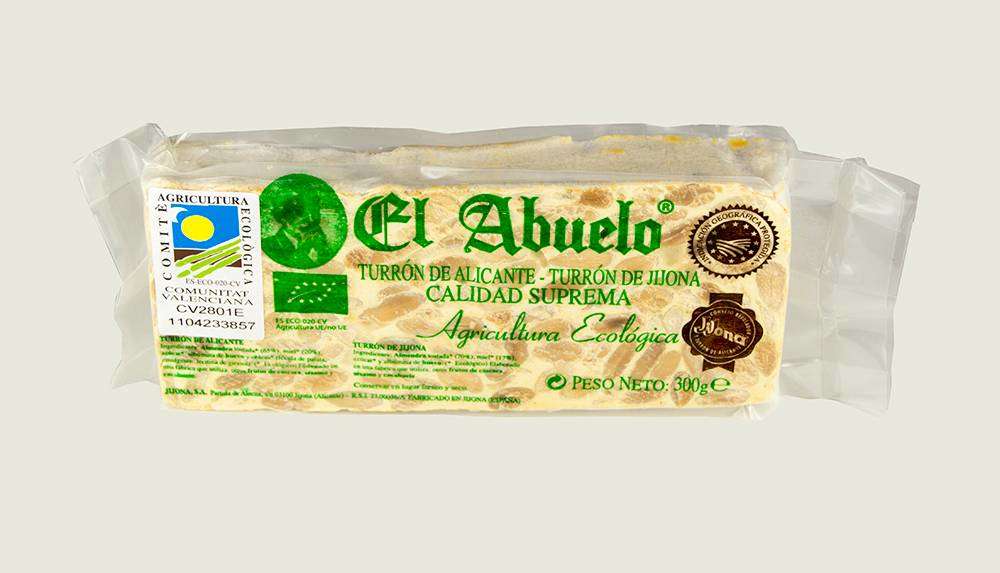 Turrón Alicante Ecológico El Abuelo 300 g de Jijona S.A., elaborado con almendra y miel ecológicas, lleva en la parte delantera los sellos de certificación y calidad.