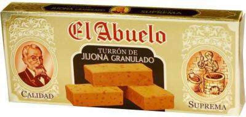 Caja de 24 unidades de Turrón de Jijona (blando) El Abuelo, Jijona S.A.; en la caja aparecen un hombre y una mujer mayores elaborando turrón y tres piezas de turrón blando con almendra tostada.