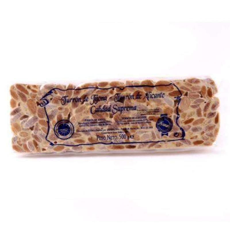 Un bloque rectangular de 500 g de Turrón de Alicante duro de Jijona S.A., Alicante, con almendras enteras, en envase transparente etiquetado "Turrón de Jijona, Turrón de Alicante, Calidad Suprema.